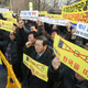 Taxi drivers and taxi industry officials hold a rally in Seoul, South Korea, 4 February 2015, demanding that Uber withdraw from the market.